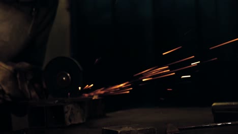 female welder working at work shop