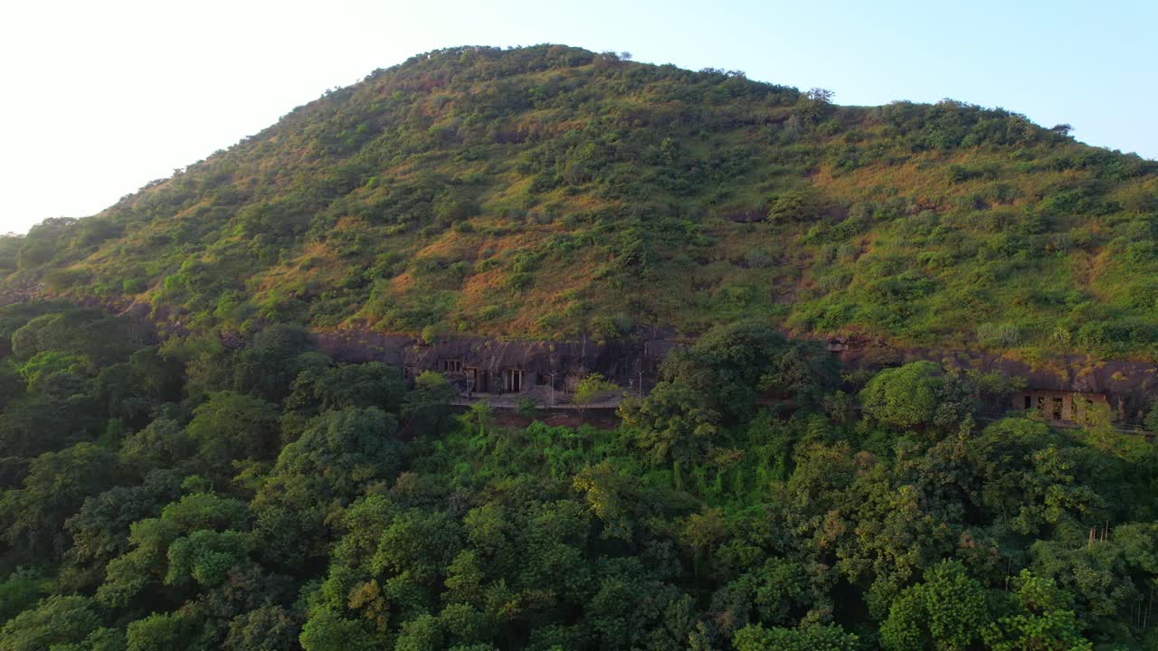 Historical Nashik Caves or Pandavleni Buddhist site at sunrise, Maharashtra, establishing drone shot