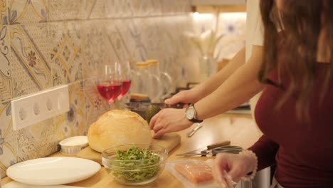 loving couple making a sandwich in kitchen-living room