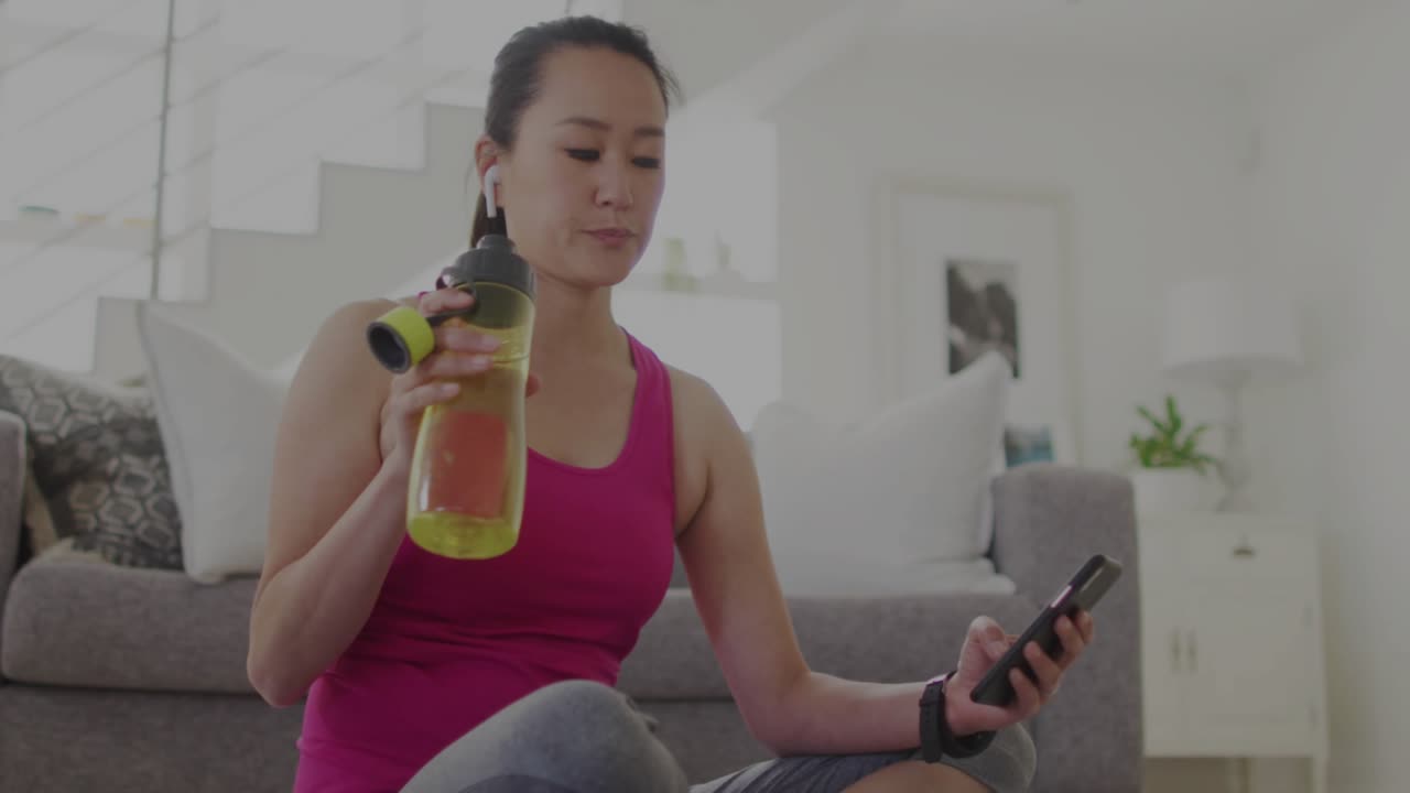 Woman sipping bottle checking smartphone activating port scan overlay highlighting net status