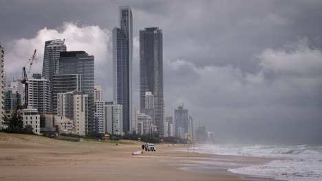 medium shot of heavy storms over beaches on the gold coast causing rough seas and rain, queensland, australia.