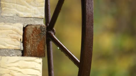 handle of wather well in farm from behind, europe