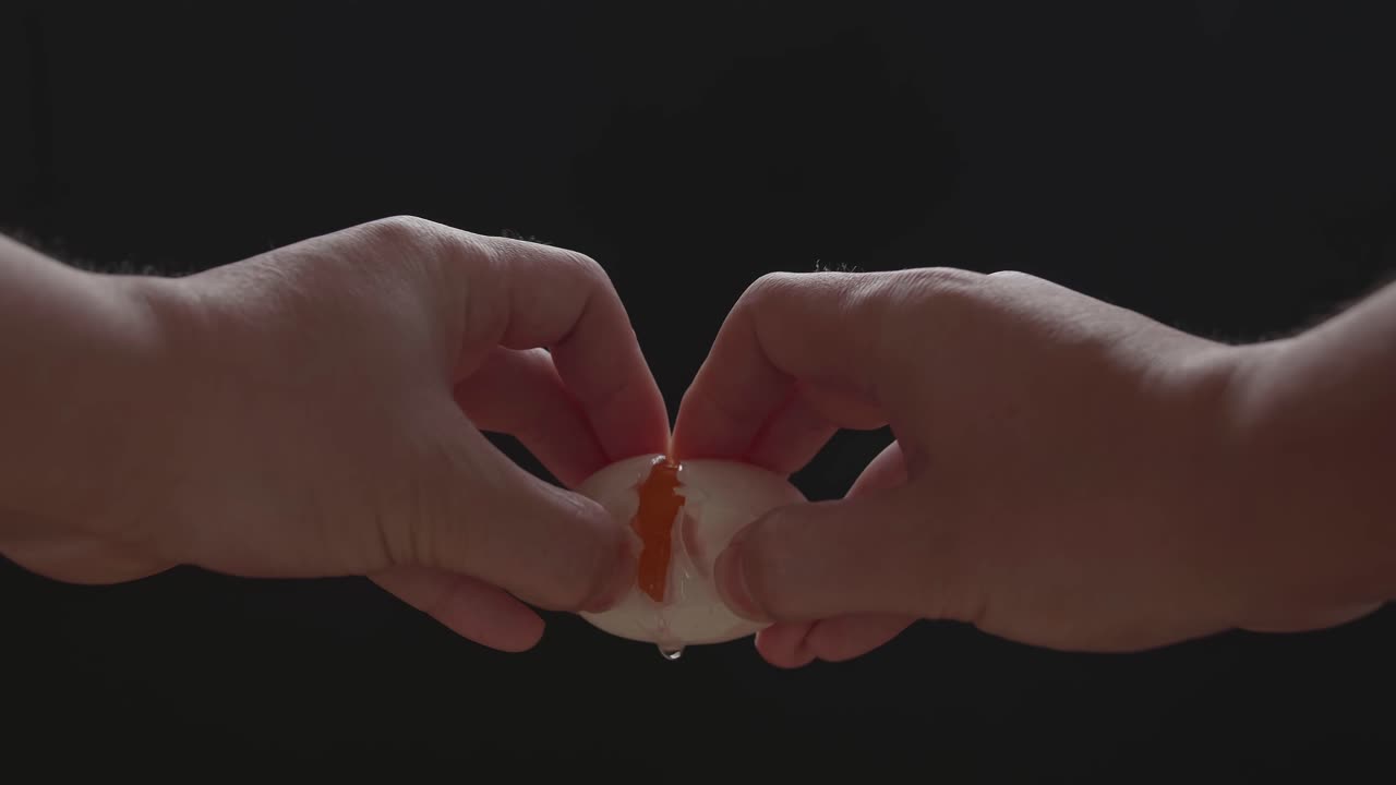 Hands Holding And Squeeze The Duck Eggs. Black Background. Quality Of The Protein In Eggs That Really Stands Out