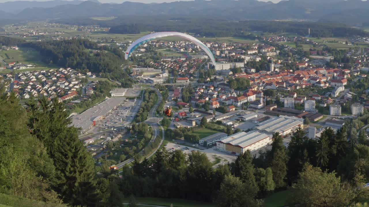 Paraglider Getting Close To Hillside Before Flying Off In Slovenia. Follow Shot