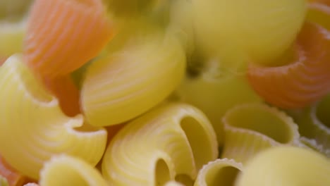 Pipe-Rigate-Pasta-Tricolore,-Macro-shot,-Pipe-Rigate-Pasta-Tricolore-slowly-falling