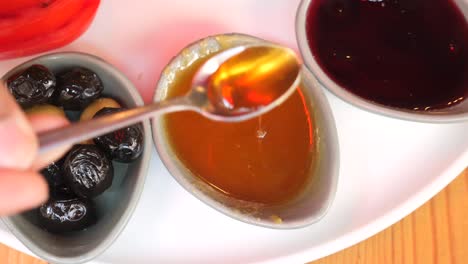 turkish breakfast with honey, olives, and jam