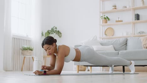 woman doing plank exercise at home
