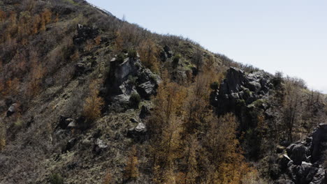 Aerial-drone-shot-of-rocky-ridge-of-rock-canyon,-Utah-and-surrounding-landscape