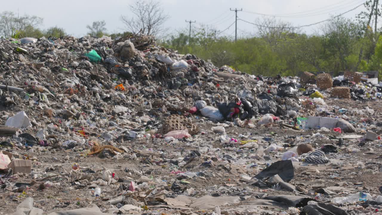 Rubbish tip, landfill, waste area in Lembongan Bali medium ground shot
