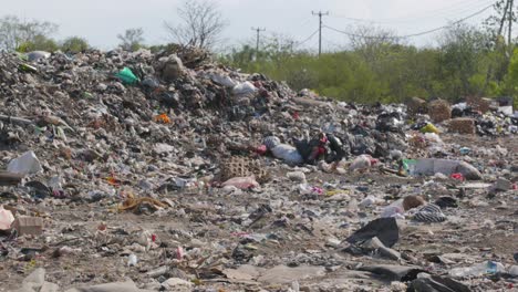 Rubbish tip, landfill, waste area in Lembongan Bali medium ground shot