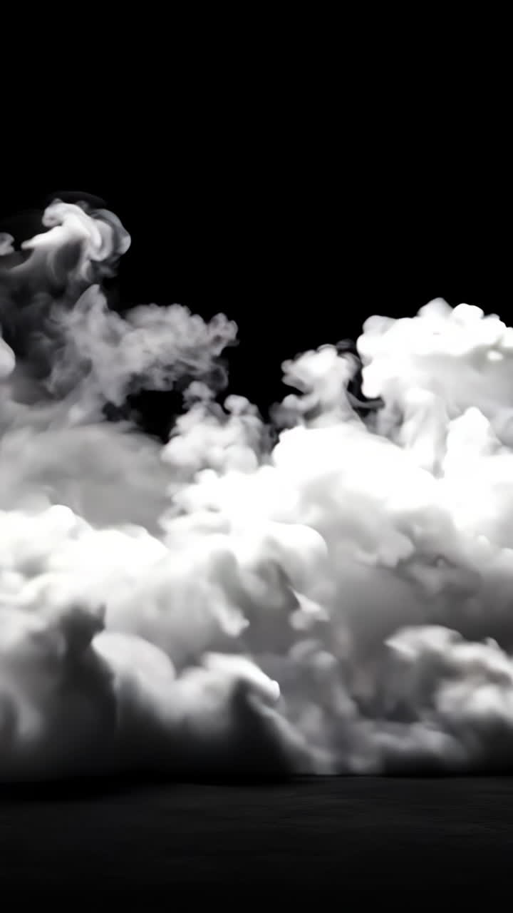 A black and white photo of a cloud of smoke. The smoke is thick and billowing, creating a sense of mystery and intrigue. The image evokes a feeling of uncertainty and unease