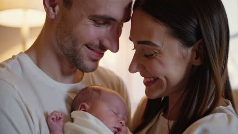 loving parents cherishing their newborn baby