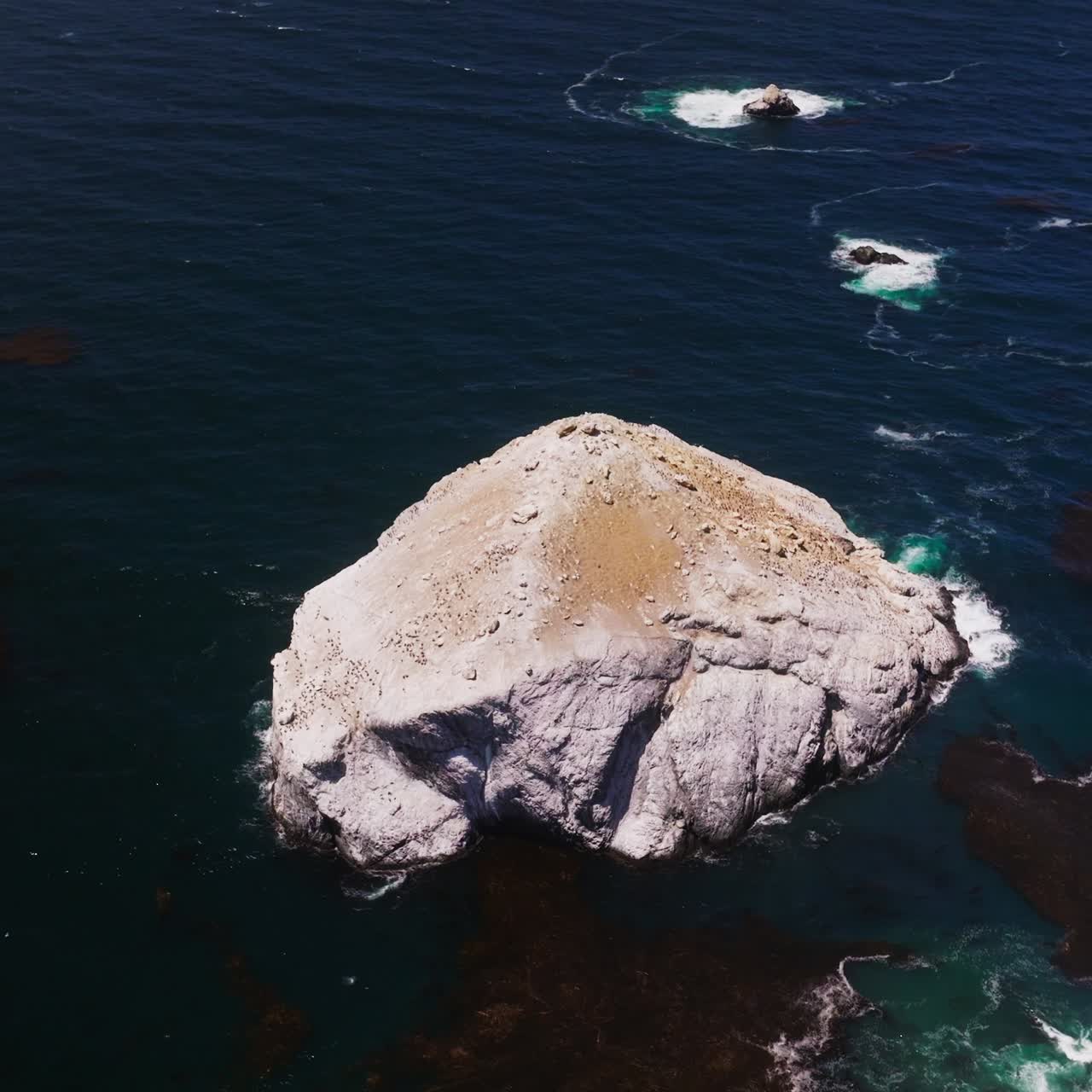 The Pacific Ocean batters the rugged shore. California scenery of seascape