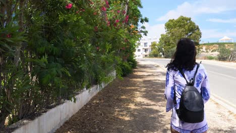 woman walking on a sunny street