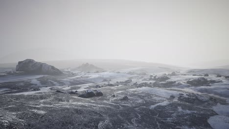 antarctic mountains with snow in fog