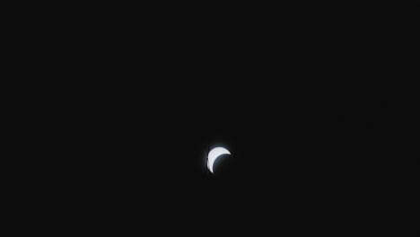 a partial solar eclipse captured at night in little rock, arkansas, usa