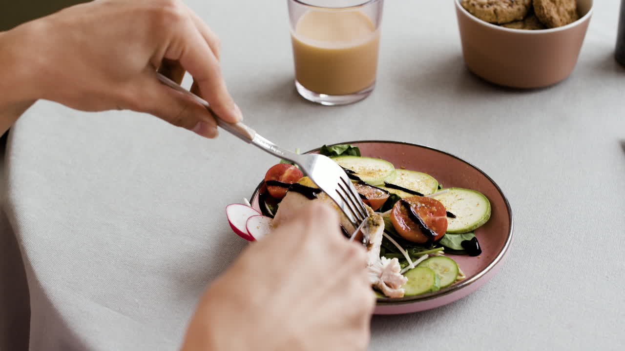 Person eating a healthy meal with salad