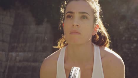 woman playing tennis on a sunny day