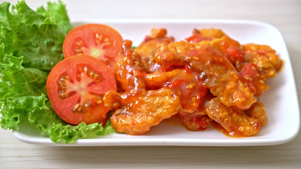 Fried fish topped with three flavors (sweet, sour, spicy) chili sauce