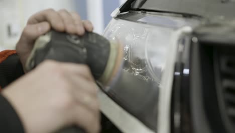 polishing a car headlight