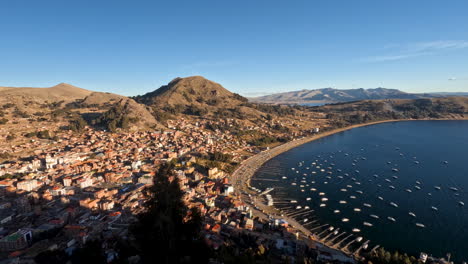 experience a breathtaking sunset over copacabana, bolivia, from cerro calvario in this captivating time-lapse. beauty of the town and lake titicaca as the sky transforms with vibrant golden hour