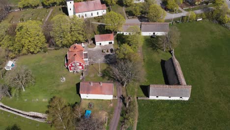 Drone-Shot-Over-18th-Century-Stone-Barns-at-Glomminge-Prastgard,-Oland-island,-Sweden