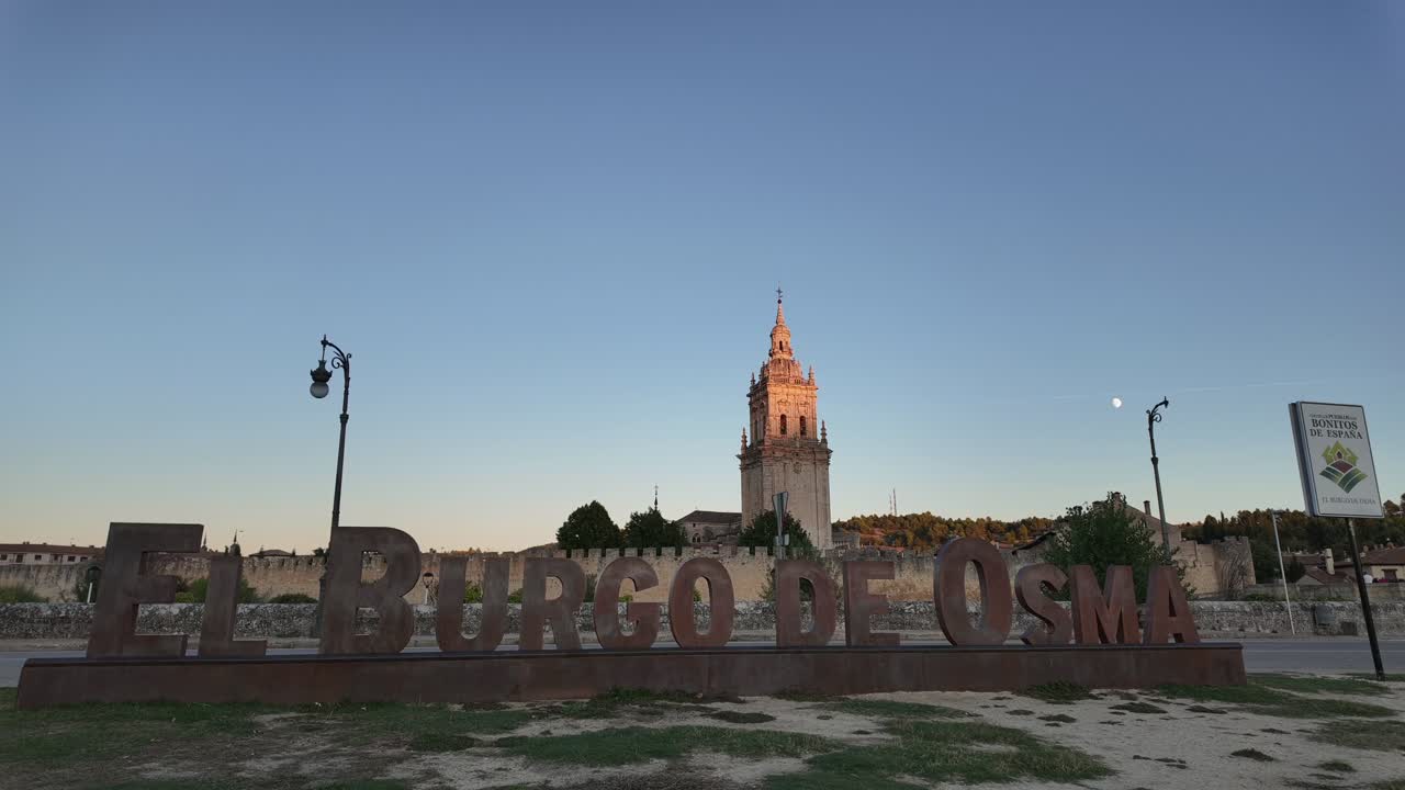 Timelapse of El Burgo de Osma medieval city in Soria, Spain. View of the cathedral tower, walls and city center at golden hour.