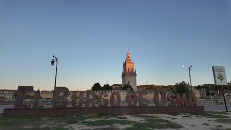 timelapse of el burgo de osma medieval city in soria, spain. view of the cathedral tower, walls and city center at golden hour.