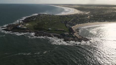 Aerial-Drone-Fly-Above-Cabo-Polonio-Hamlet,-Uruguayan-Coast-in-Rocha,-Blue-Ocean-and-Calming-Landscape