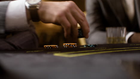 man playing poker at the casino.