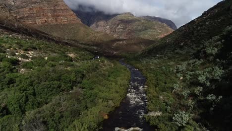 aerial footage over the freestone streams in the du toitskloof mountains in the western cape of south africa