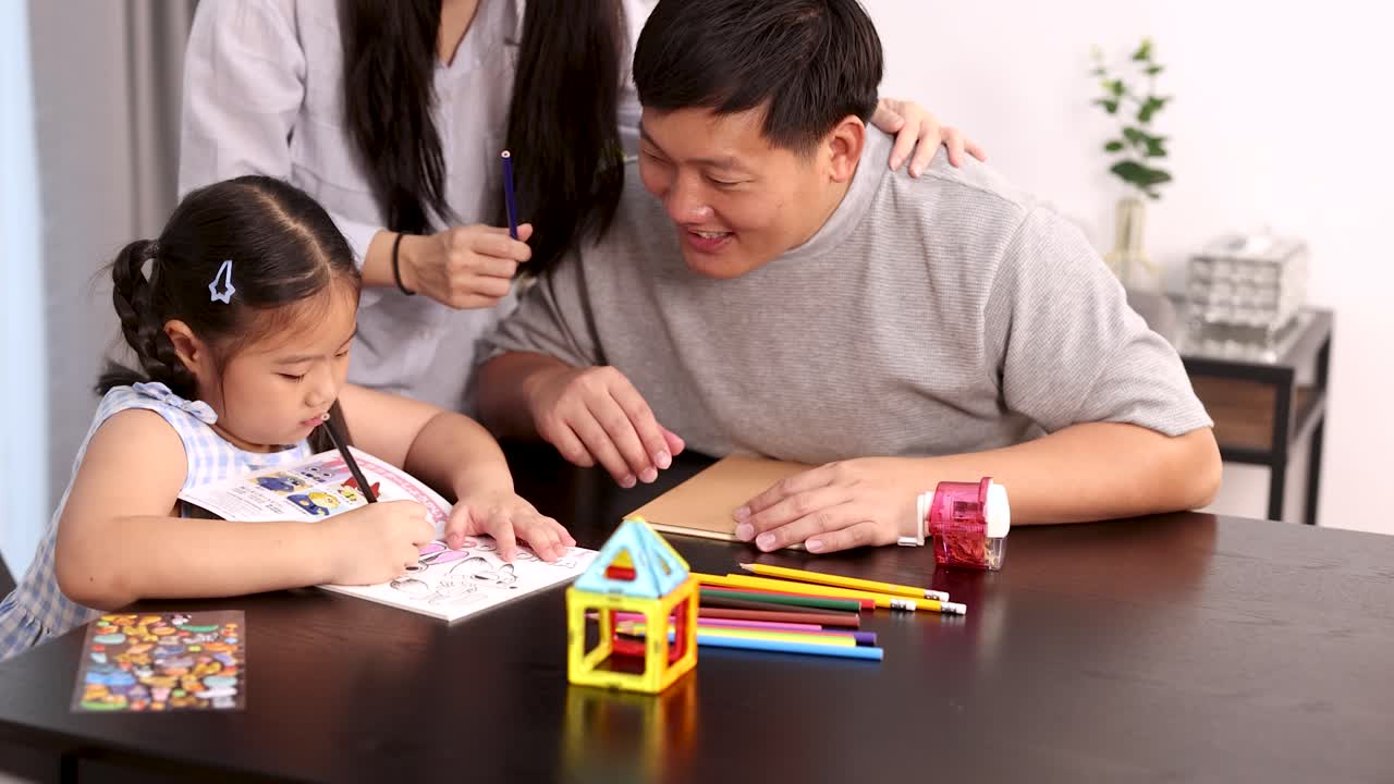 Father, mother, and daughter draw and color together at home, bright lighting, cheerful atmosphere