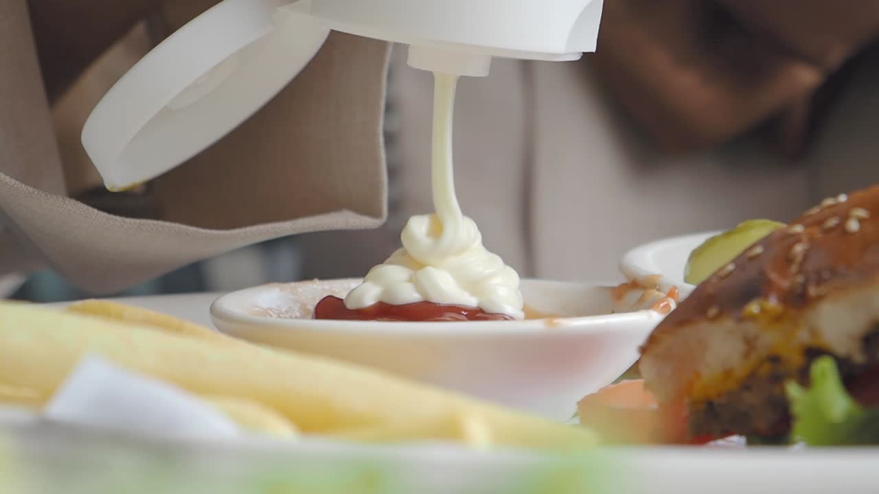 Serving a Burger with Fries and Sauces