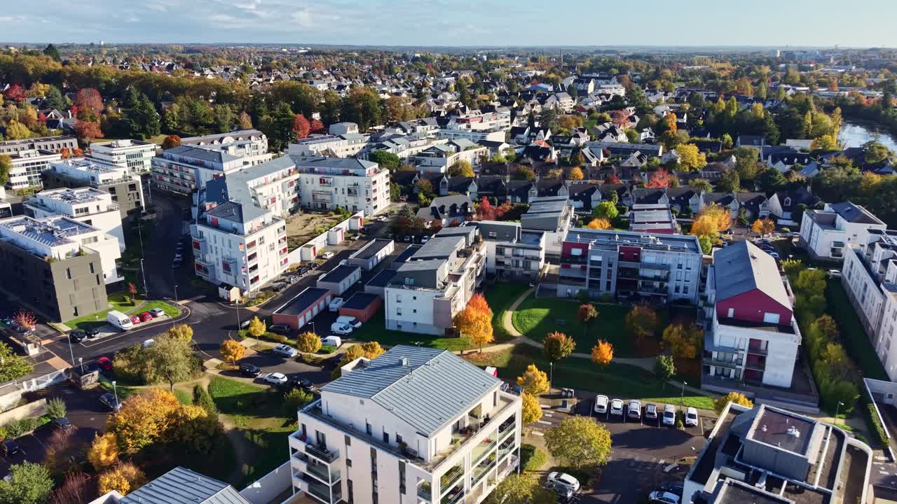 Amazing drone fly of commune center with autumn trees and modern buildings, Cesson-Sévigné, Ille-et-Vilaine, Brittany, France