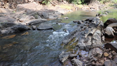 Static-shot-of-stony-riverbed-on-sunny-day