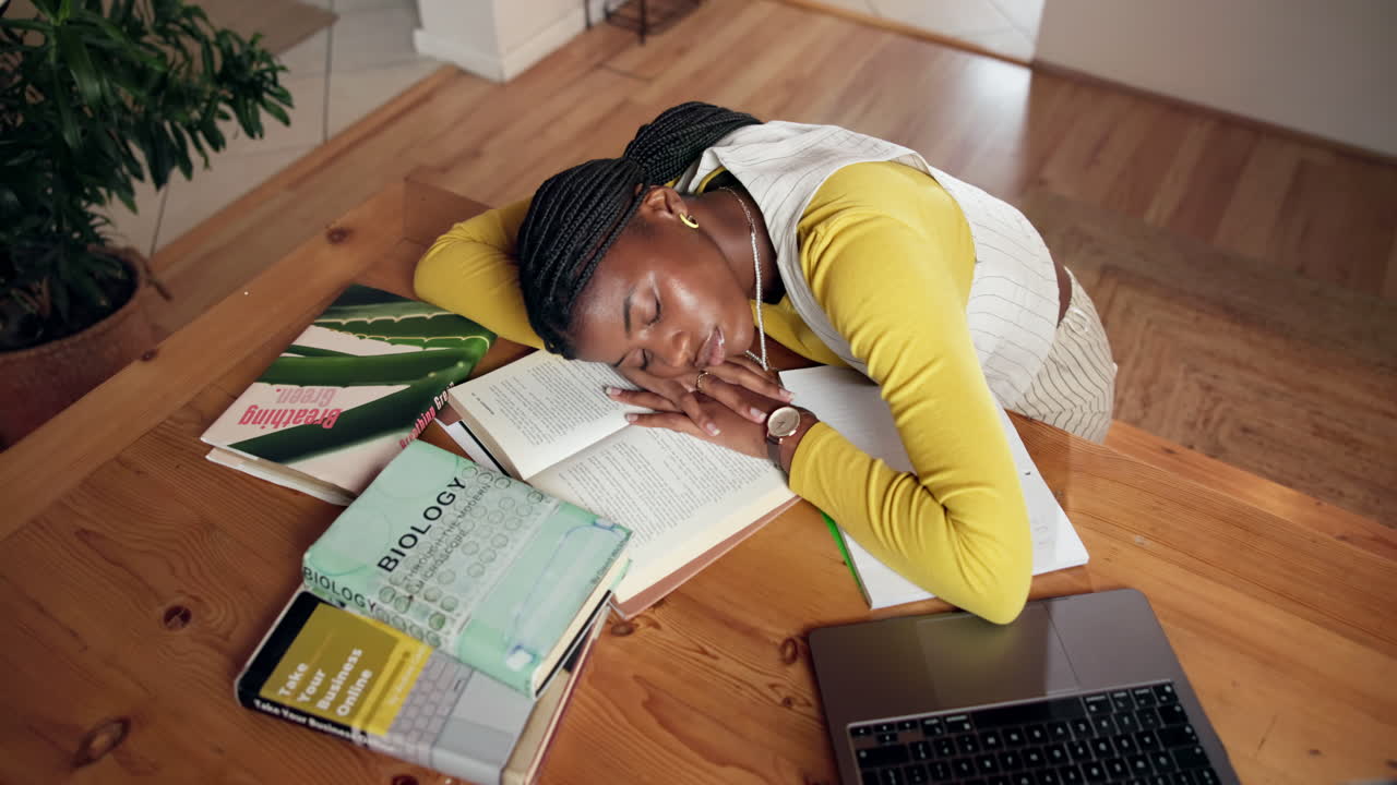 Tired Student Sleeping on Books