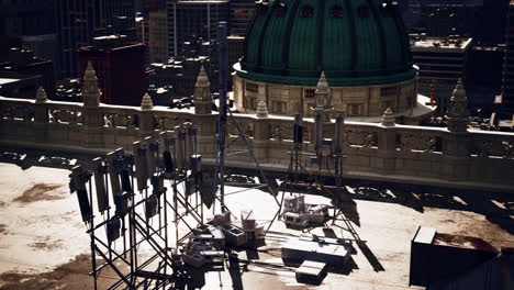 a rooftop view of a city with a dome-shaped building in the background