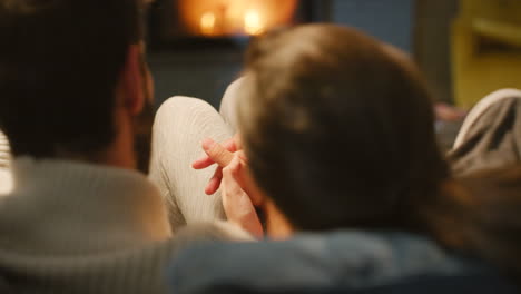 couple by the fireplace