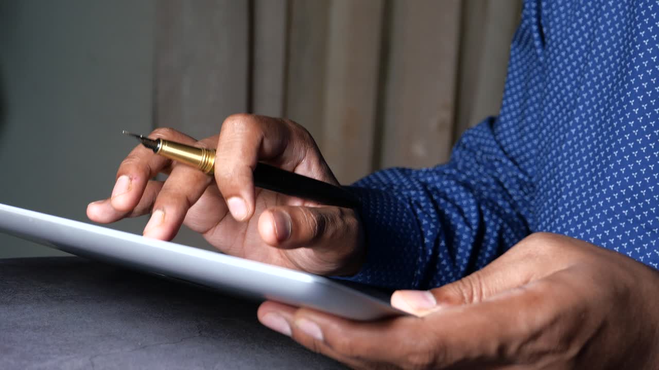 Person using a tablet and pen