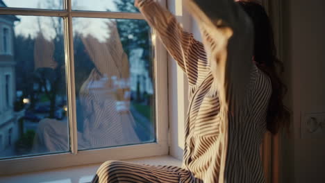 woman relaxing by the window