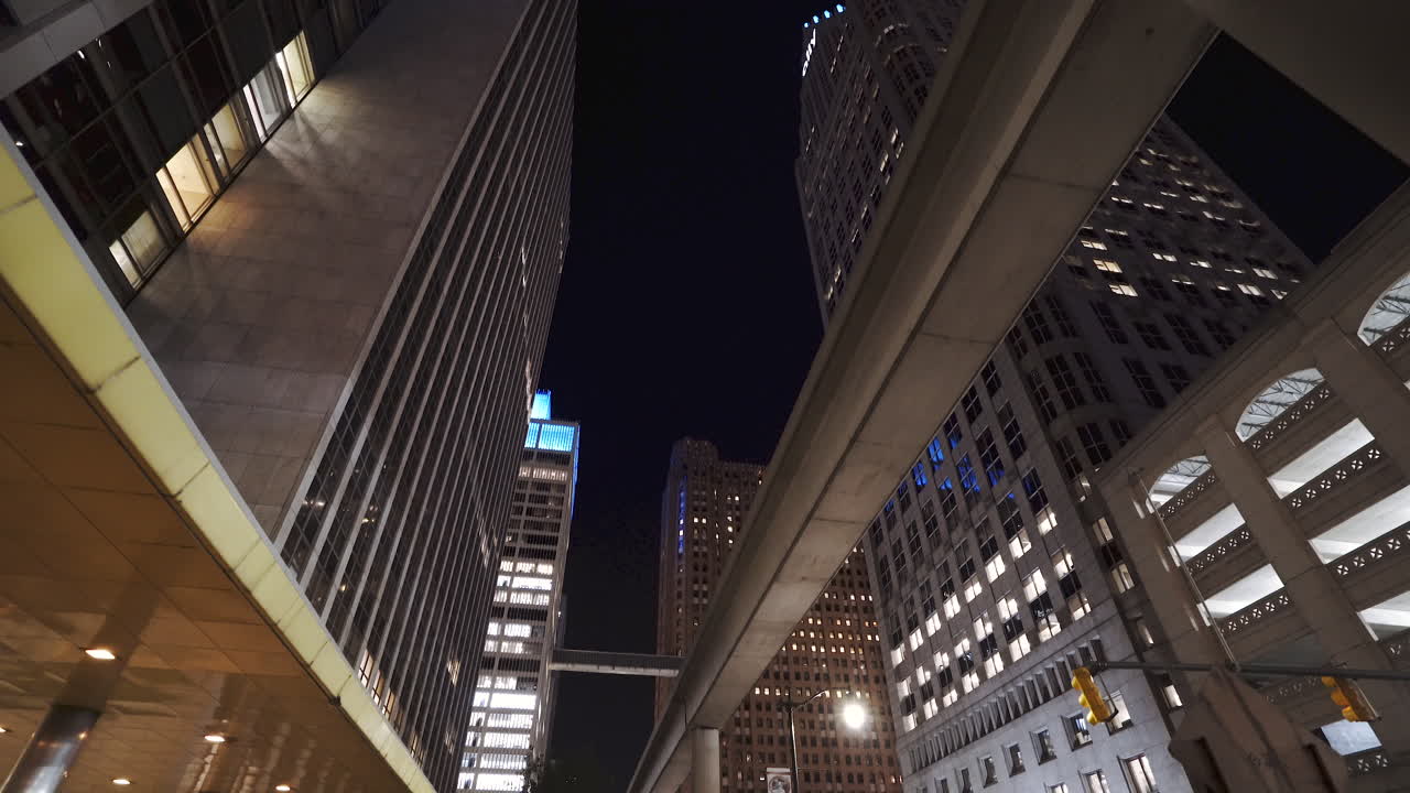 Tracking in on the skyscrapers and people mover of Detroit at night