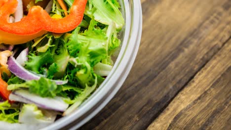 animation of close up of vegetable salad on countertop in kitchen