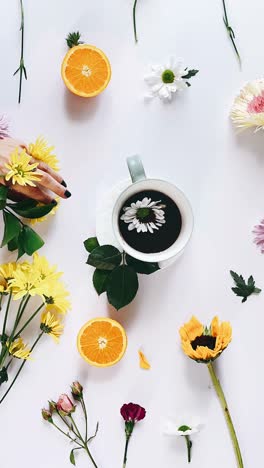floral coffee arrangement with a woman's hand