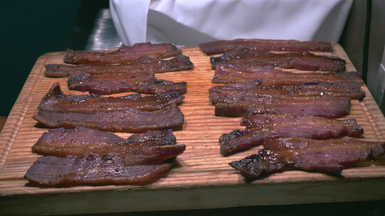 Beef strips placed under heater at Brazilian restaurant