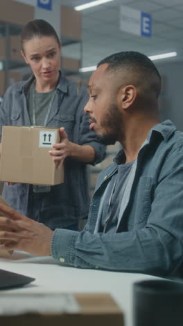 warehouse workers checking packages