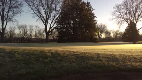 Golf-Course-Bunker-In-The-Morning-With-Golden-Sun-Shining-At-Calm-Sunrise