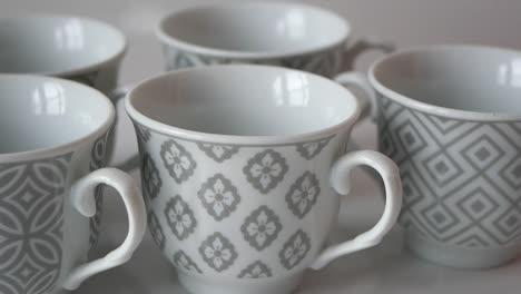 set of grey and white patterned coffee/tea cups