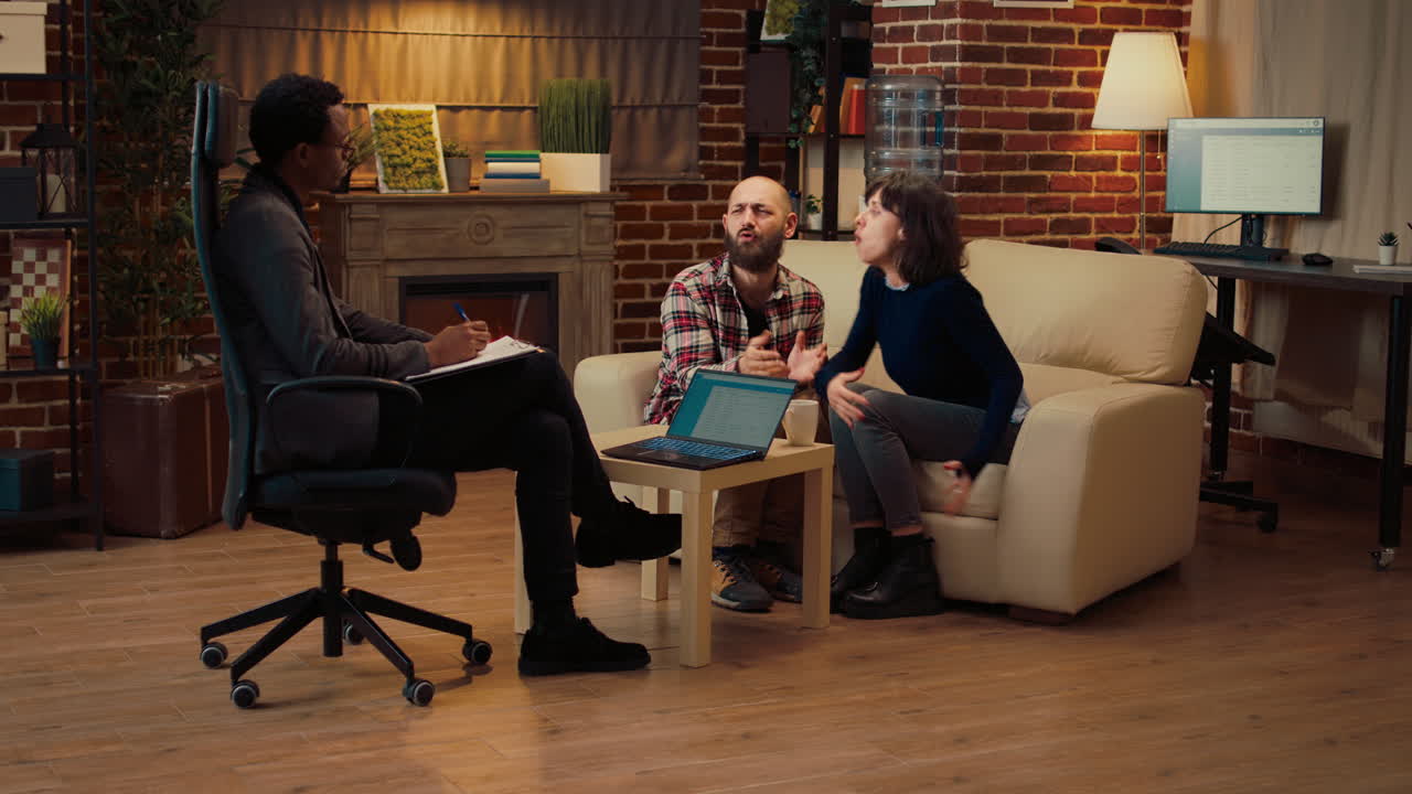 Psychologist listening to people fighting at couple therapy session