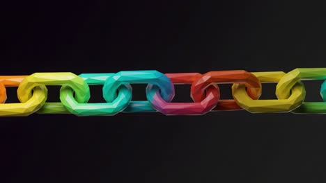 a vibrant, multicolored chain reflecting unity and connectivity with angular links in various bright colors, set against a dark background for striking contrast