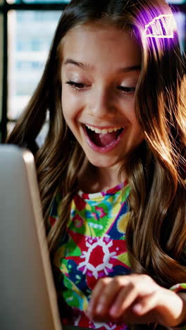 girl excitedly using laptop